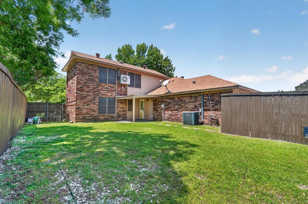 272 Lodge Road Coppell, TX 75019 - Photo 18 of 24 a front view of house with yard and green space