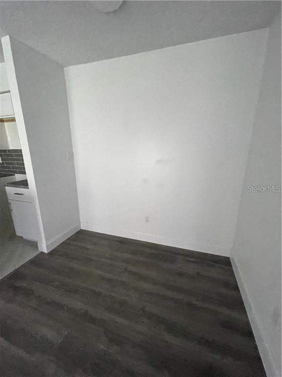 232 Afton Square, Unit 112 Altamonte Springs, FL 32714 - Photo 7 of 13 wooden floor in an empty room