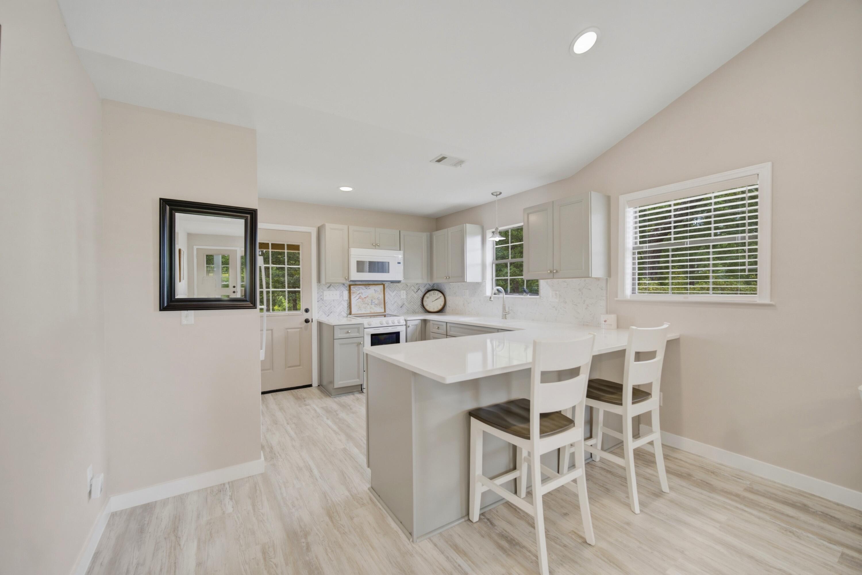 261 Wilkerson Road DeFuniak Springs, FL 32433 - Photo 54 of 76 a view of a dining room with furniture and wooden floor