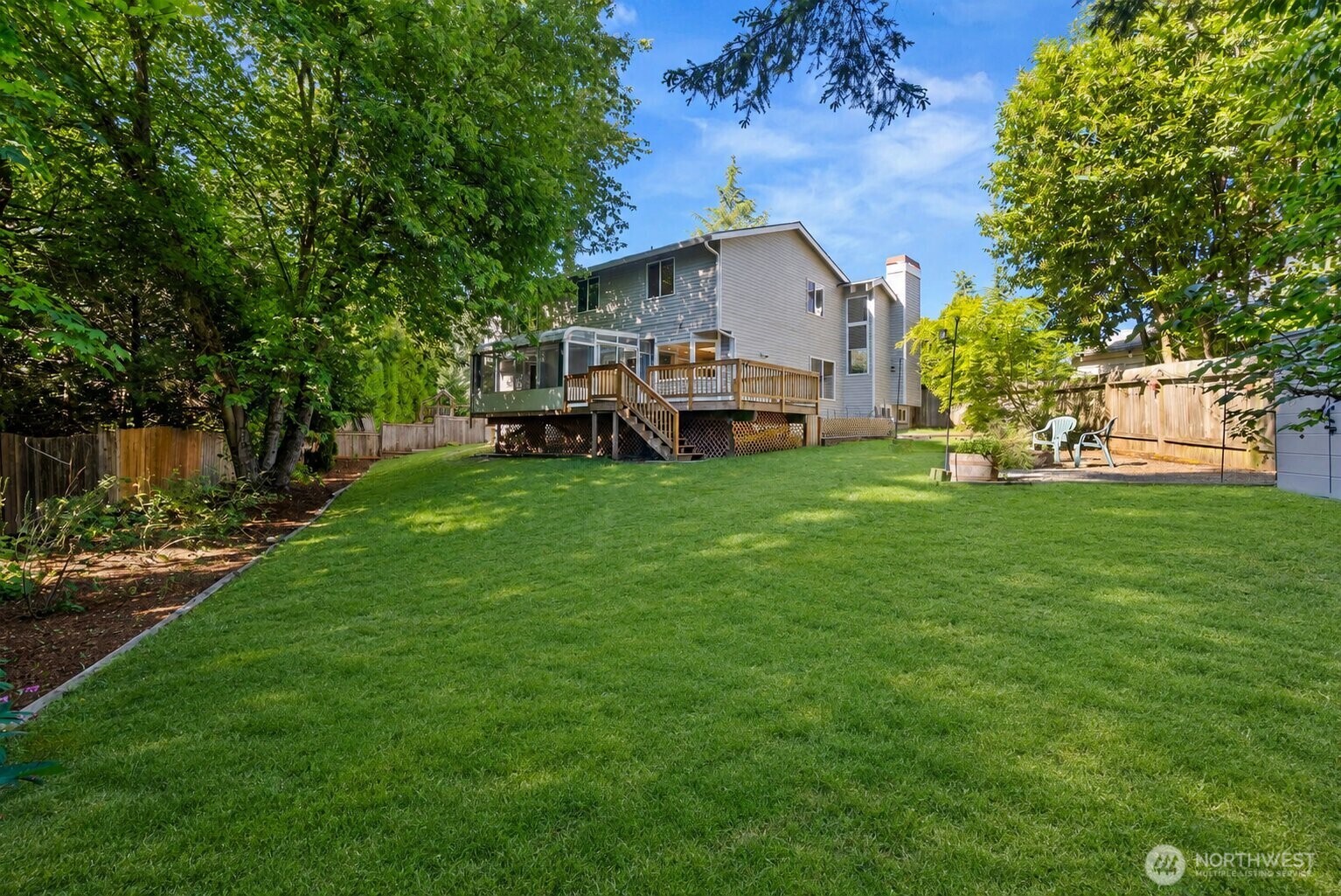 13603 Southeast 239th Street Kent, WA 98042 - Photo 21 of 23 a view of a house with a yard deck and sitting area