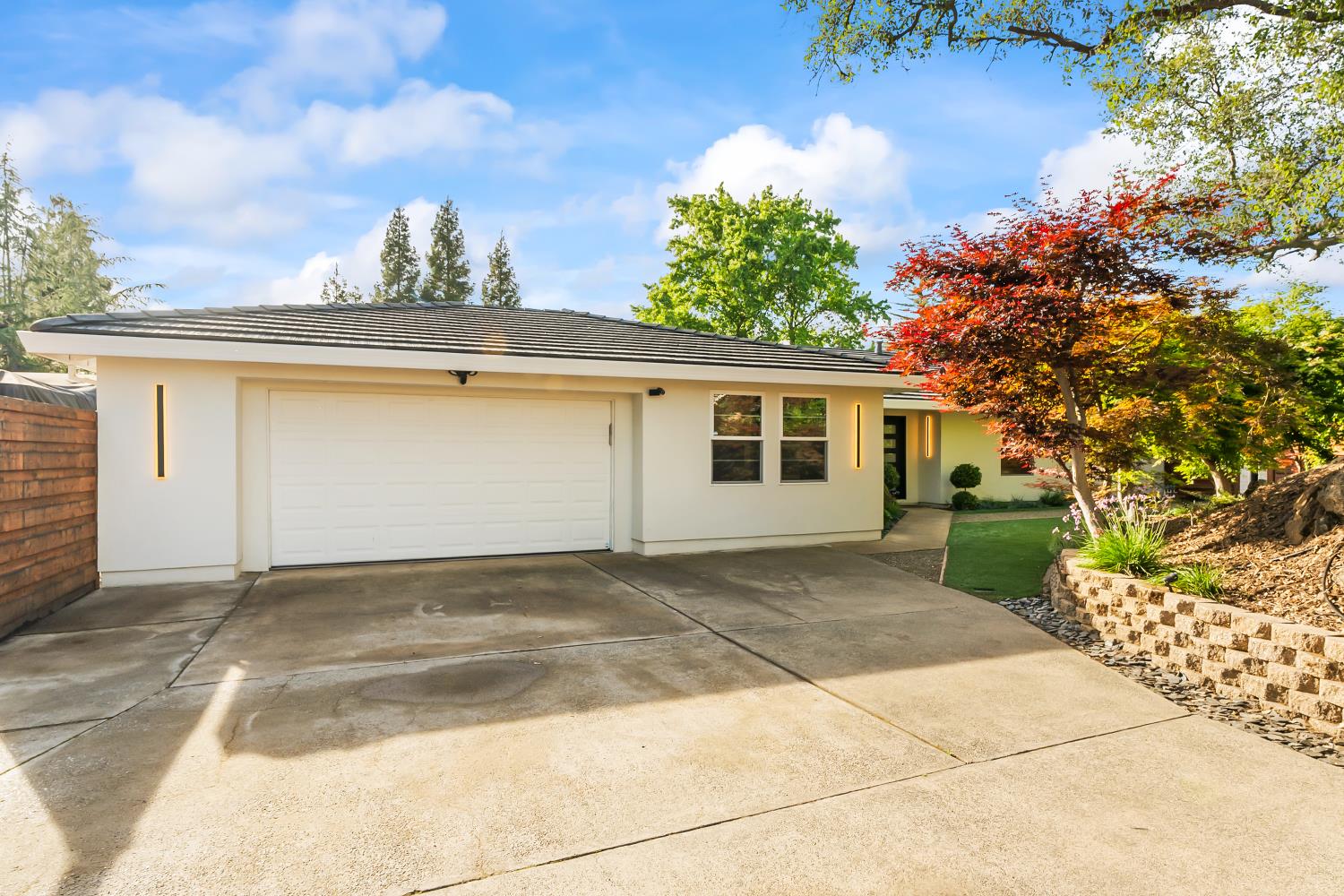 6762 Highland Road Granite Bay, CA 95746 - Photo 12 of 90 a view of a house with a yard and potted plants