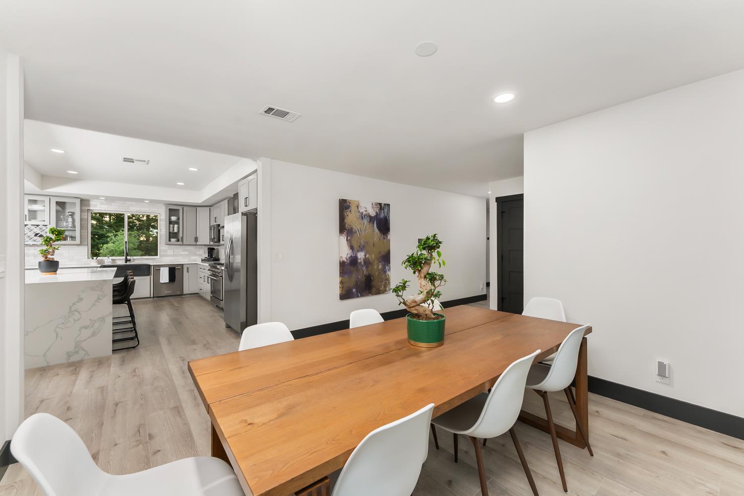 6762 Highland Road Granite Bay, CA 95746 - Photo 20 of 90 a dining room with furniture and wooden floor