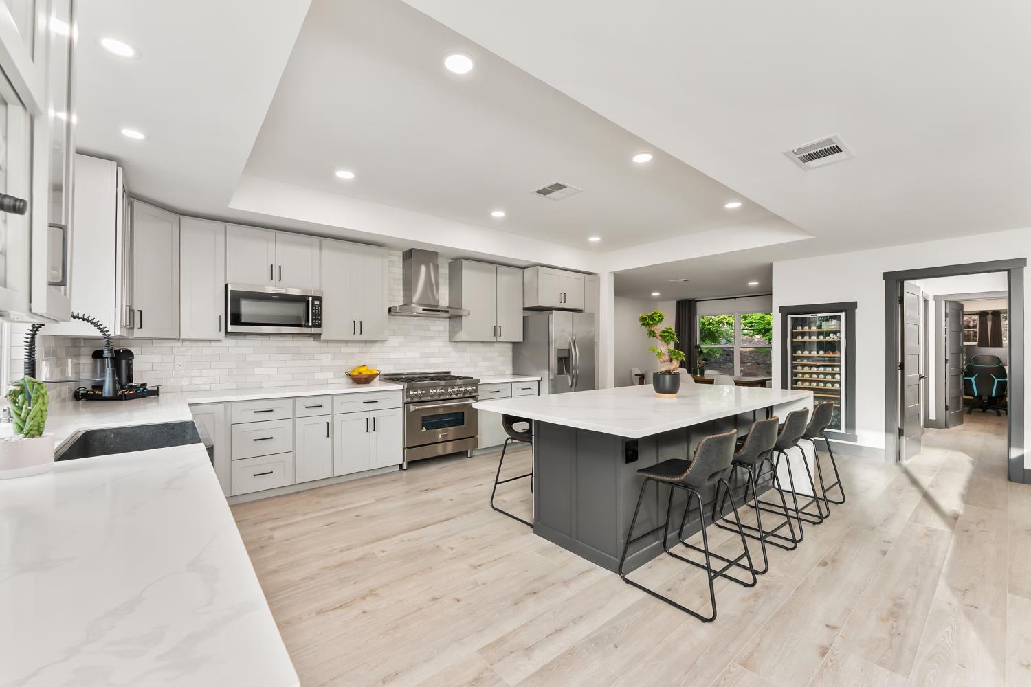 6762 Highland Road Granite Bay, CA 95746 - Photo 21 of 90 a kitchen with a sink a counter top space stainless steel appliances and cabinets