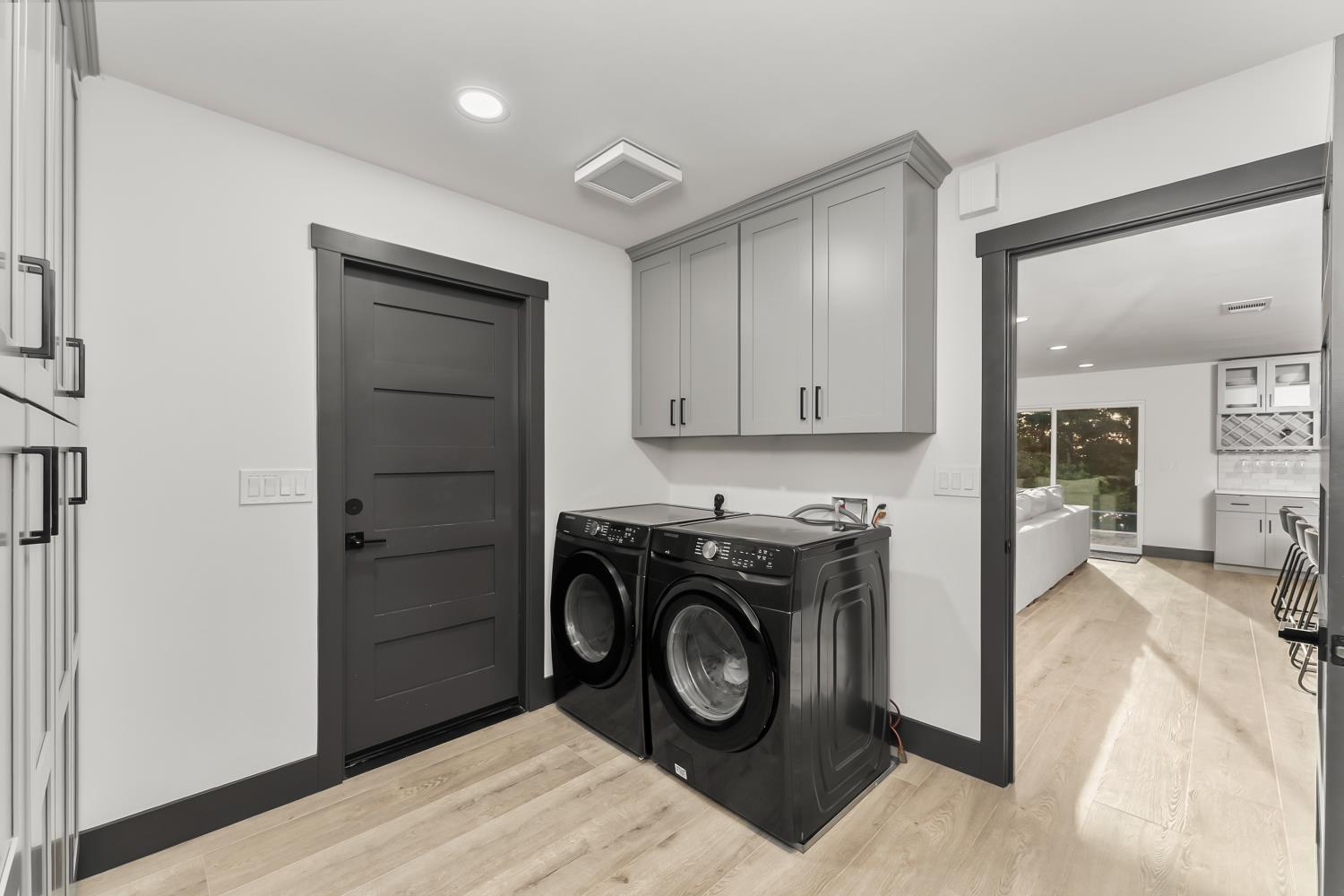 6762 Highland Road Granite Bay, CA 95746 - Photo 31 of 90 a view of a storage and utility room with washer and dryer