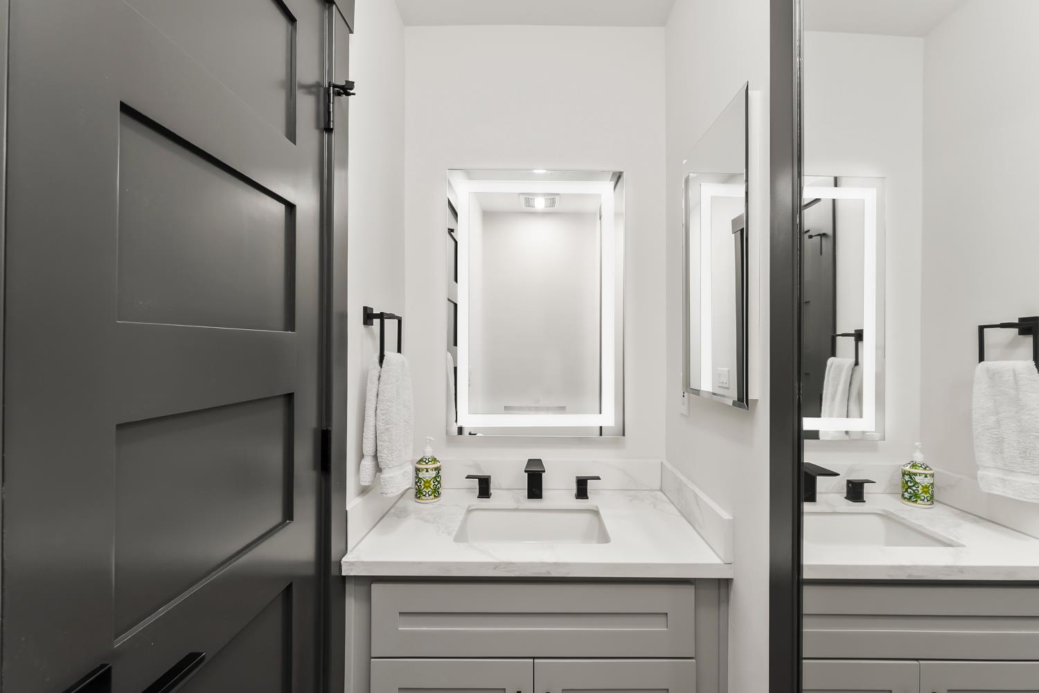 6762 Highland Road Granite Bay, CA 95746 - Photo 32 of 90 a bathroom with a sink and a mirror