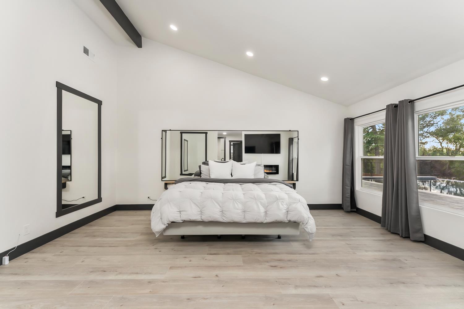 6762 Highland Road Granite Bay, CA 95746 - Photo 35 of 90 a bed room with a bed and large window