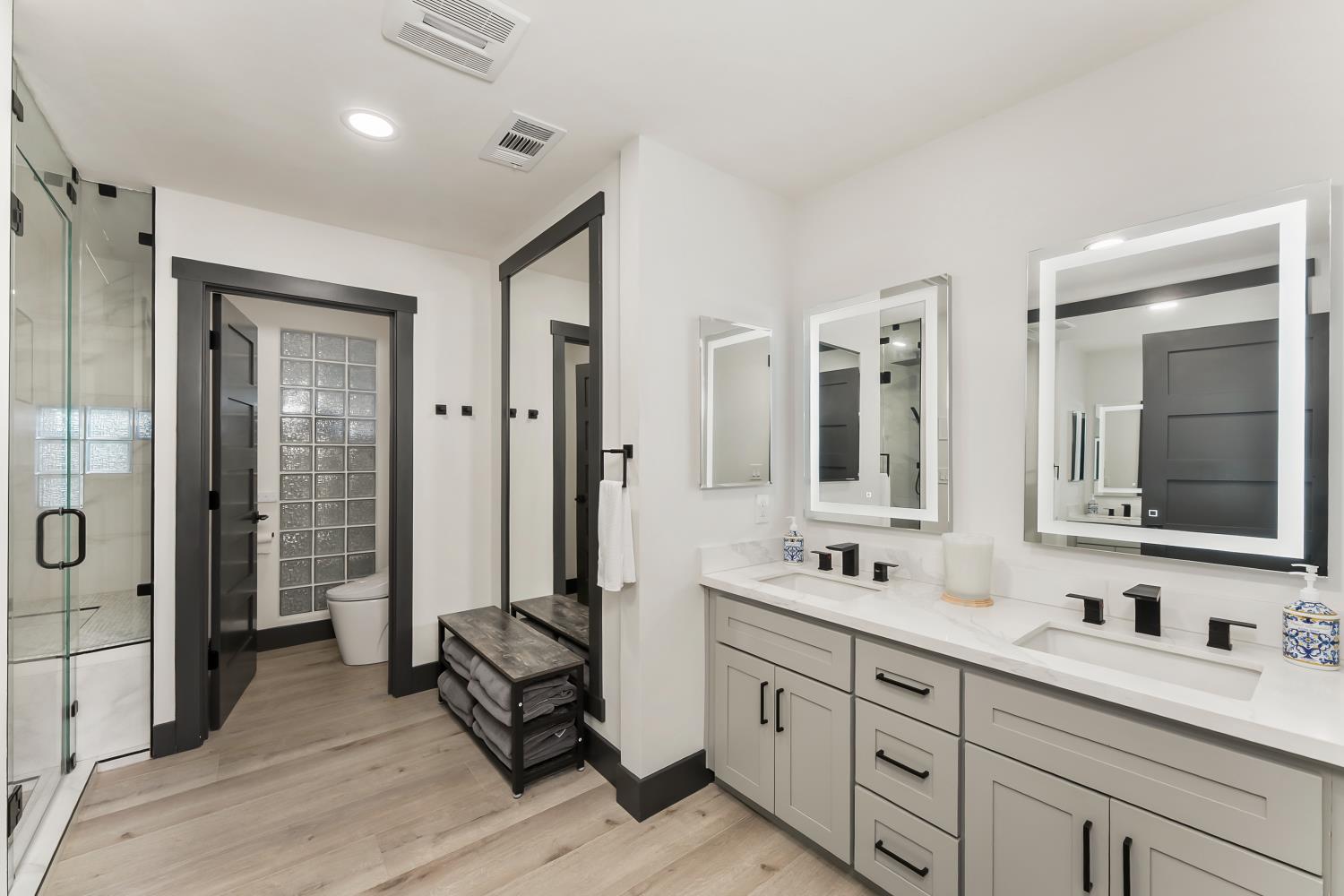 6762 Highland Road Granite Bay, CA 95746 - Photo 39 of 90 a bathroom with double vanity sink a mirror and a shower