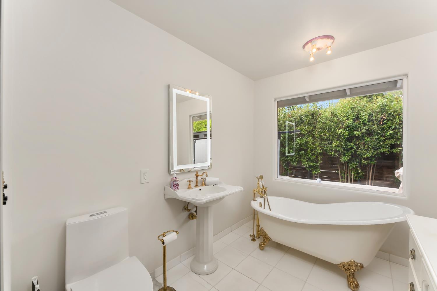 6762 Highland Road Granite Bay, CA 95746 - Photo 45 of 90 a bathroom with a sink and a mirror