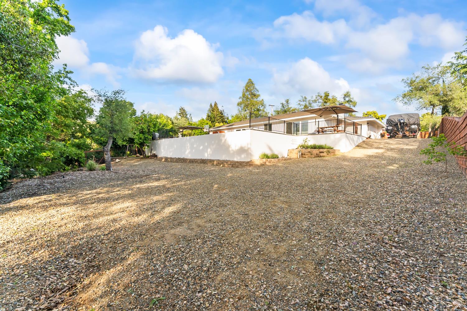 6762 Highland Road Granite Bay, CA 95746 - Photo 58 of 90 a view of yard with swimming pool and trees in the background