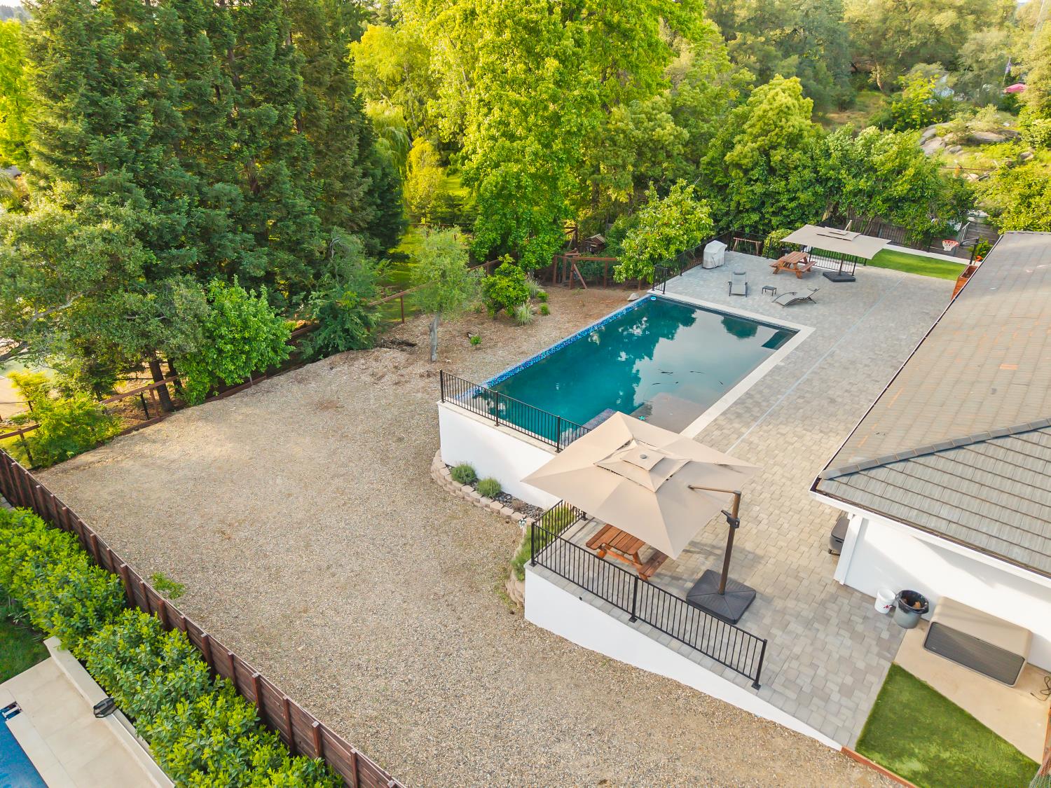 6762 Highland Road Granite Bay, CA 95746 - Photo 64 of 90 an aerial view of a house with a yard and lake view