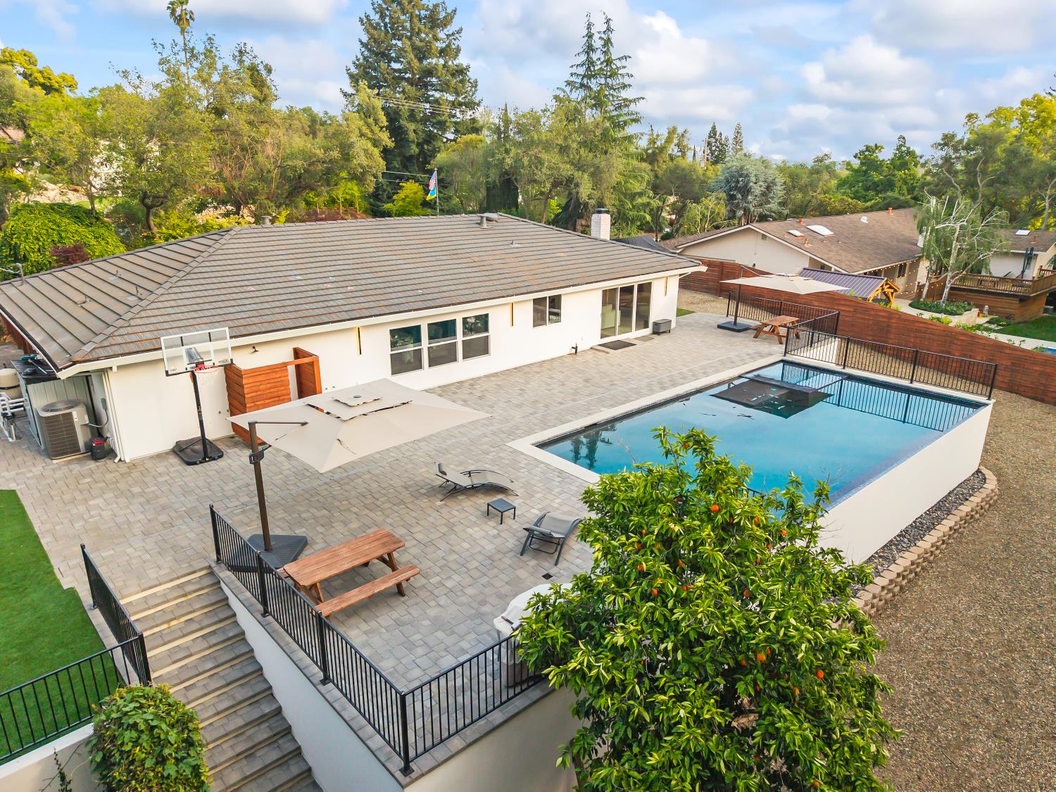 6762 Highland Road Granite Bay, CA 95746 - Photo 67 of 90 an aerial view of a house with swimming pool and furniture