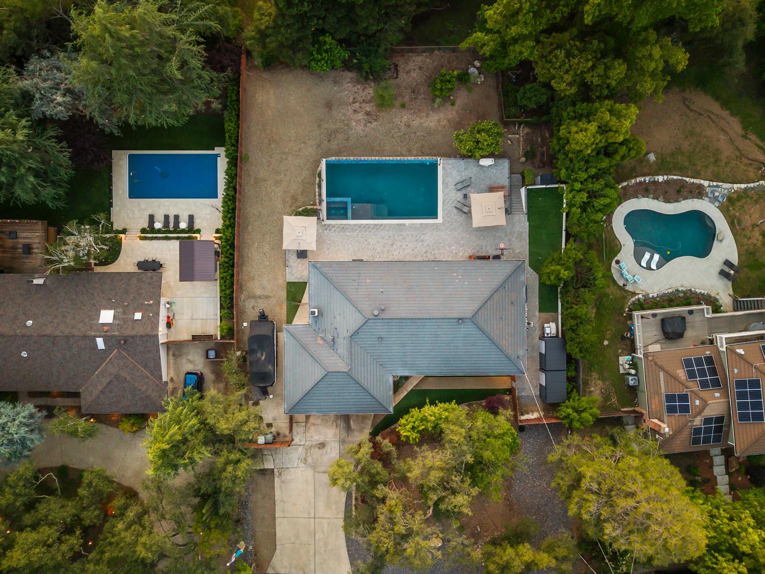6762 Highland Road Granite Bay, CA 95746 - Photo 69 of 90 an aerial view of a house with a yard and large trees