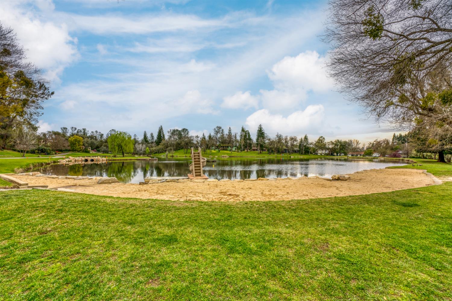 6762 Highland Road Granite Bay, CA 95746 - Photo 85 of 90 a view of a lake with houses in the back