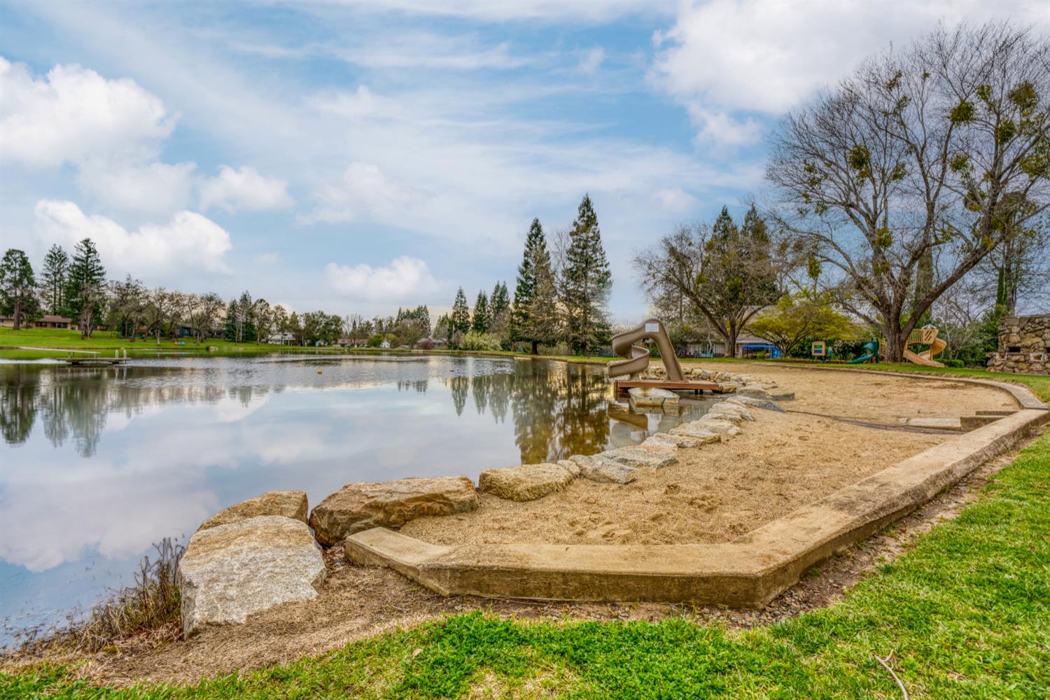 6762 Highland Road Granite Bay, CA 95746 - Photo 87 of 90 a view of a lake with houses in the back