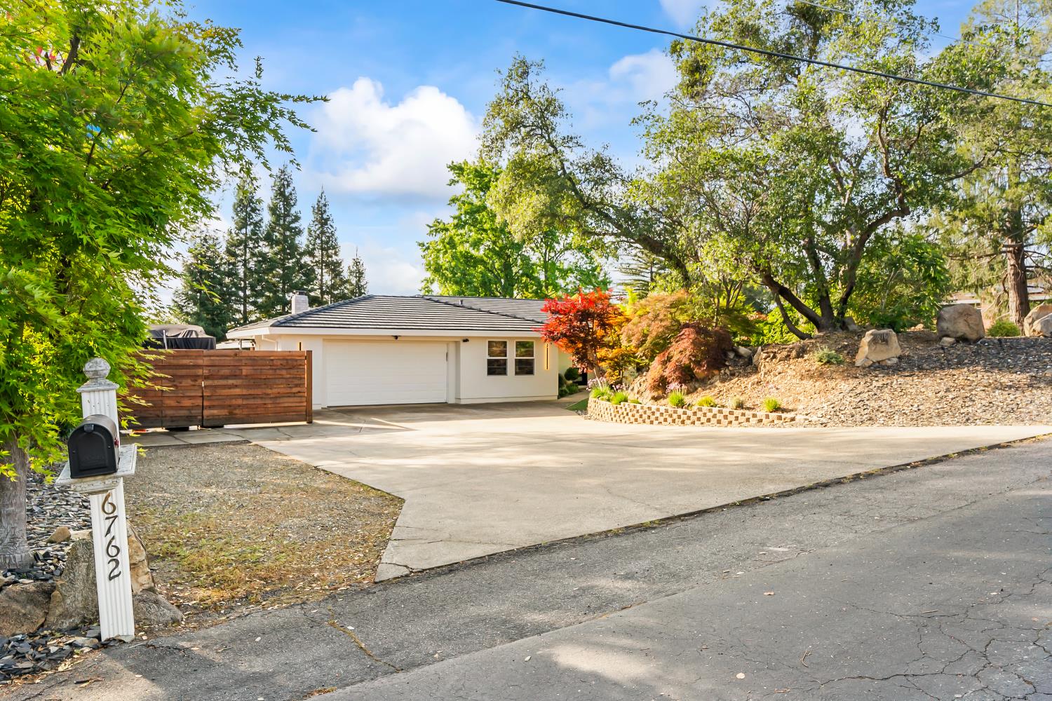 6762 Highland Road Granite Bay, CA 95746 - Photo 9 of 90 front view of a house with a trees