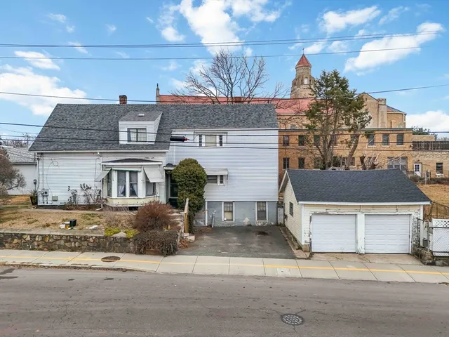a front view of a house with parking