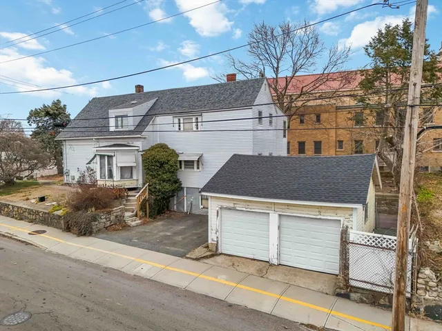 an aerial view of residential houses with outdoor space