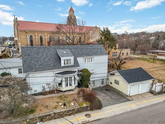 an aerial view of residential houses with outdoor space