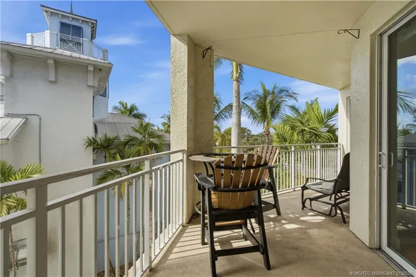 a balcony view with a potted plant