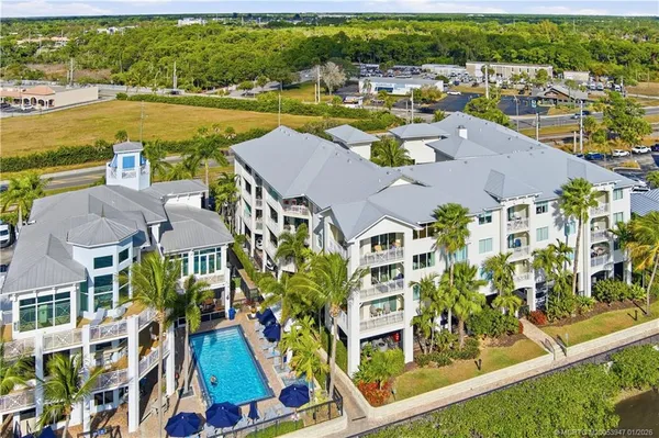 an aerial view of residential building and lake