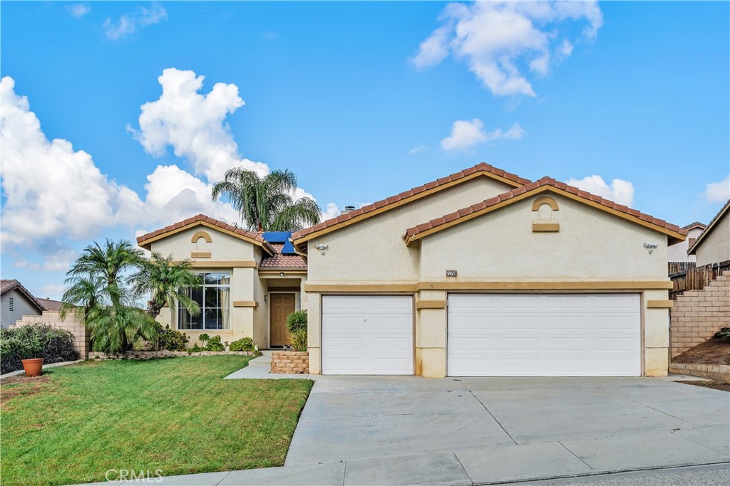 27750 Tate Road Menifee, CA 92585 - Photo 1 of 1 a front view of a house with a yard and garage