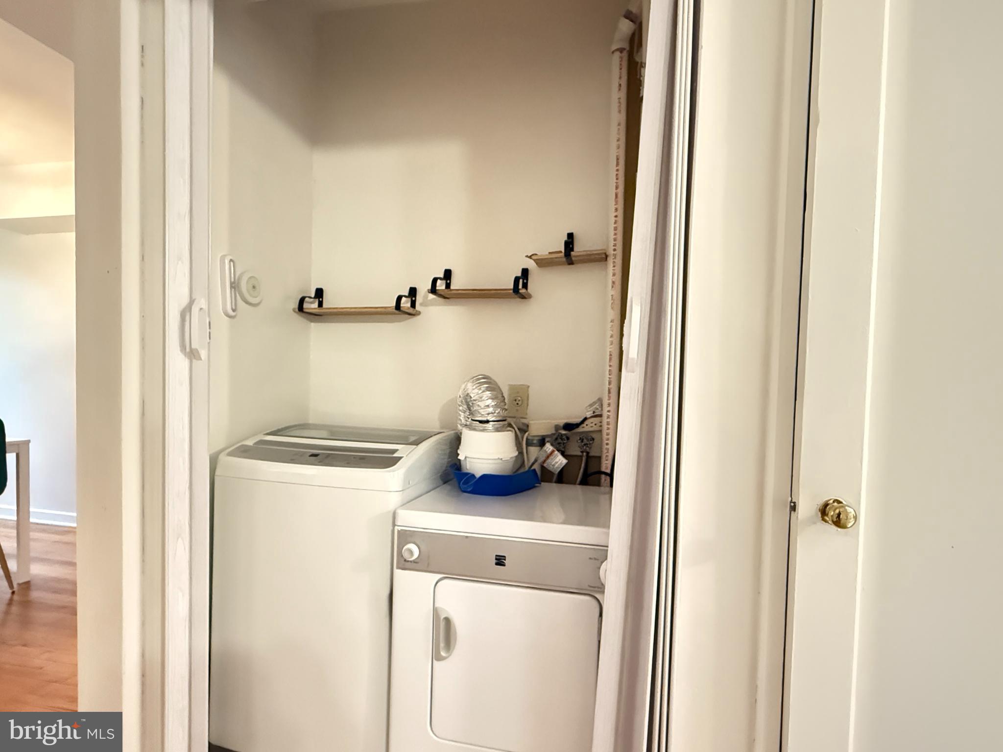 2205 Washington Avenue, Unit 102 Silver Spring, MD 20910 - Photo 17 of 20 a bathroom with a sink and a washing machine