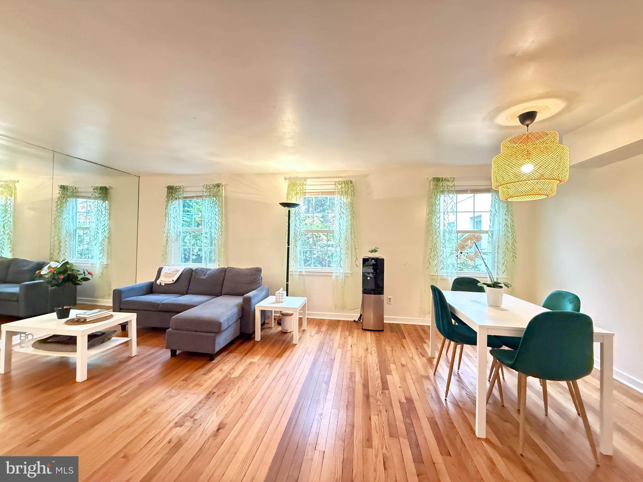 2205 Washington Avenue, Unit 102 Silver Spring, MD 20910 - Photo 5 of 20 a living room with furniture and a wooden floor