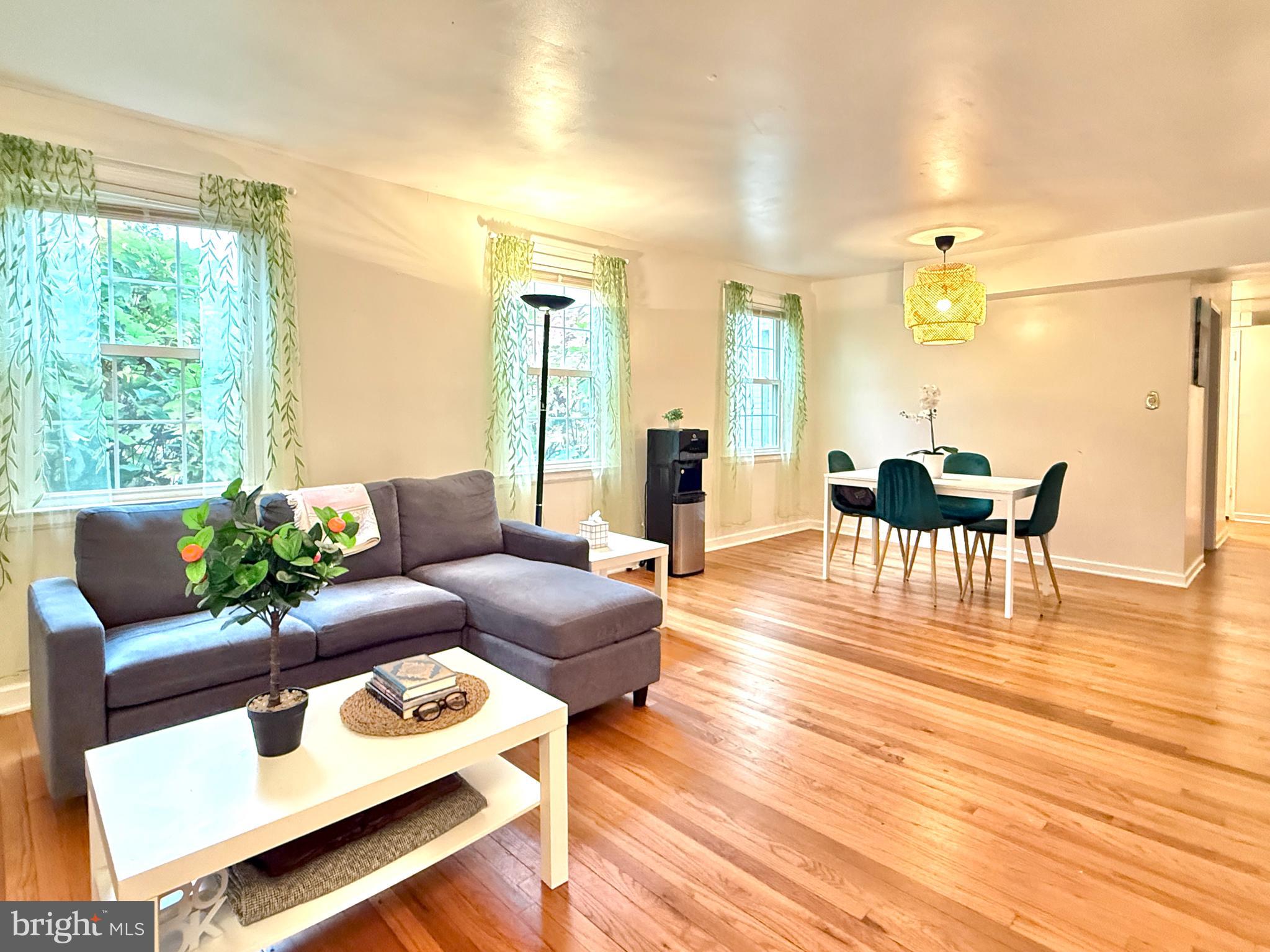 2205 Washington Avenue, Unit 102 Silver Spring, MD 20910 - Photo 6 of 20 a living room with furniture and wooden floor