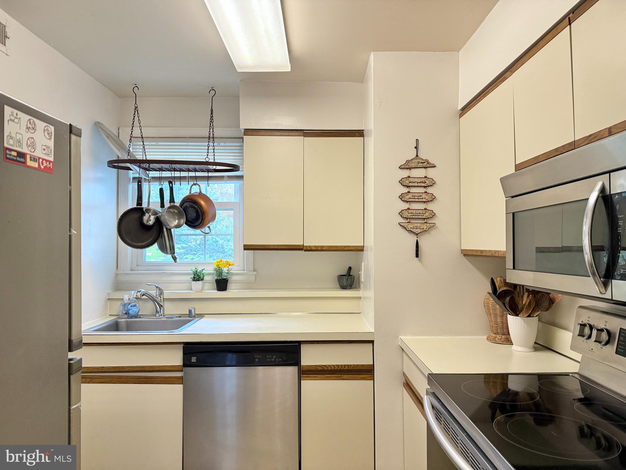 2205 Washington Avenue, Unit 102 Silver Spring, MD 20910 - Photo 8 of 20 a kitchen with a sink stove and microwave