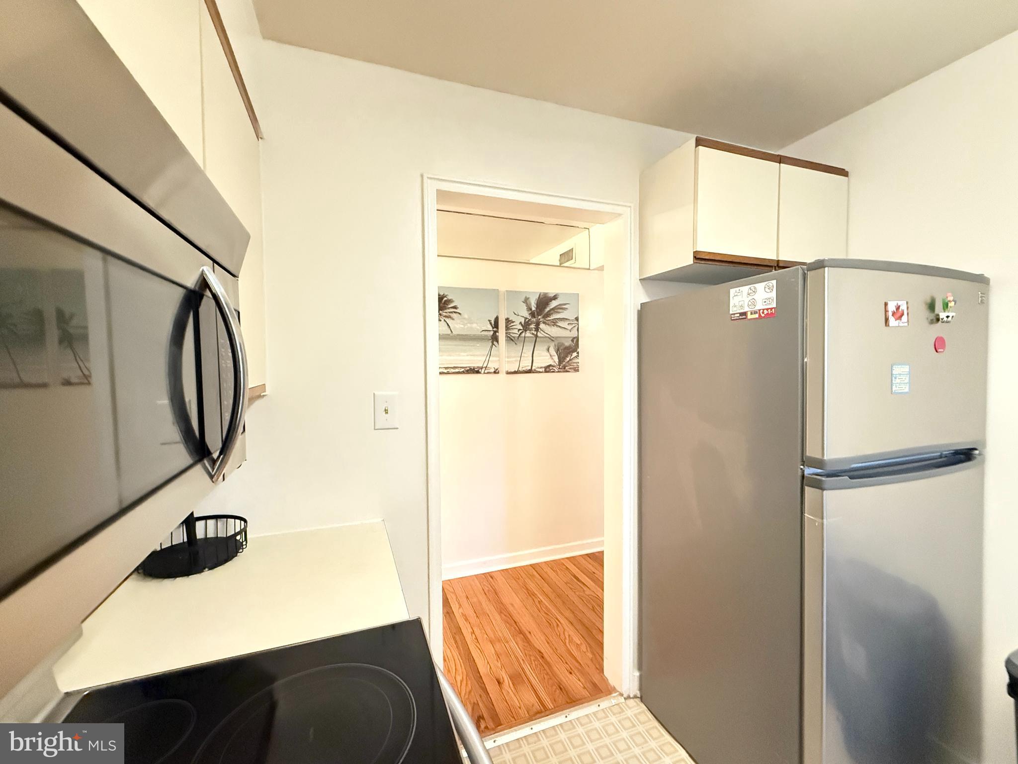 2205 Washington Avenue, Unit 102 Silver Spring, MD 20910 - Photo 9 of 20 a view of walk in closet with window and refrigerator
