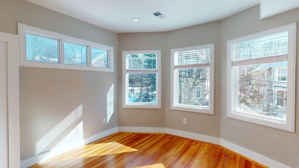 179 Appleton Street, Unit 2 Cambridge, MA 02138 - Photo 12 of 23 a view of an empty room with a window