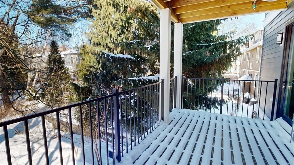179 Appleton Street, Unit 2 Cambridge, MA 02138 - Photo 23 of 23 a view of backyard with a deck and wooden floor