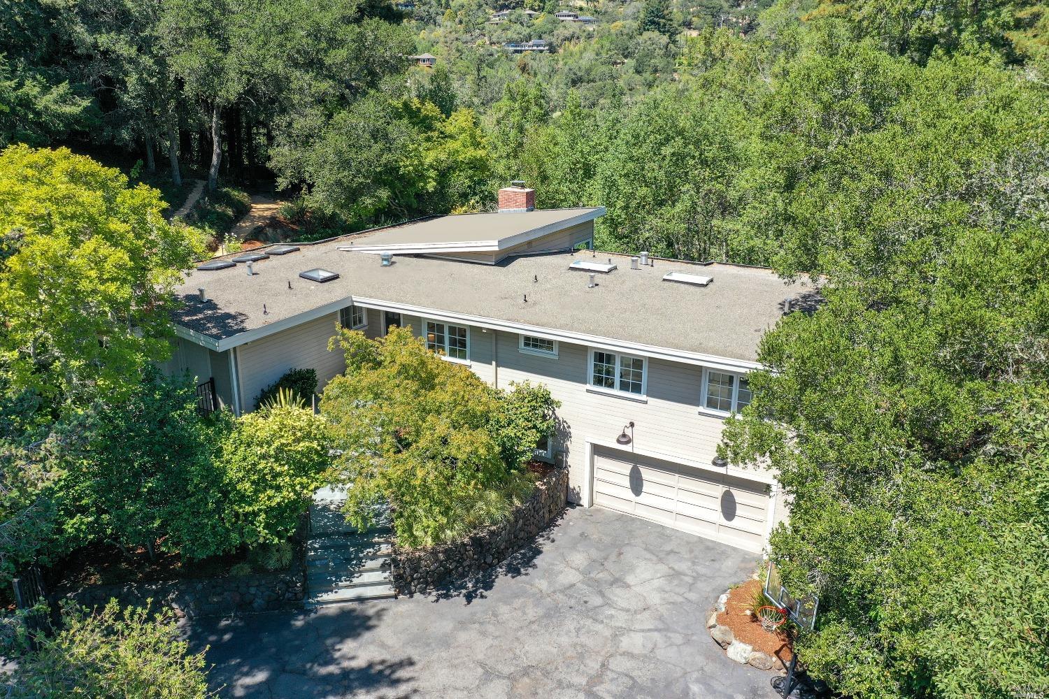 10 Turnagain Road Kentfield, CA 94904 - Photo 1 of 1 an aerial view of a house with a yard and a large tree