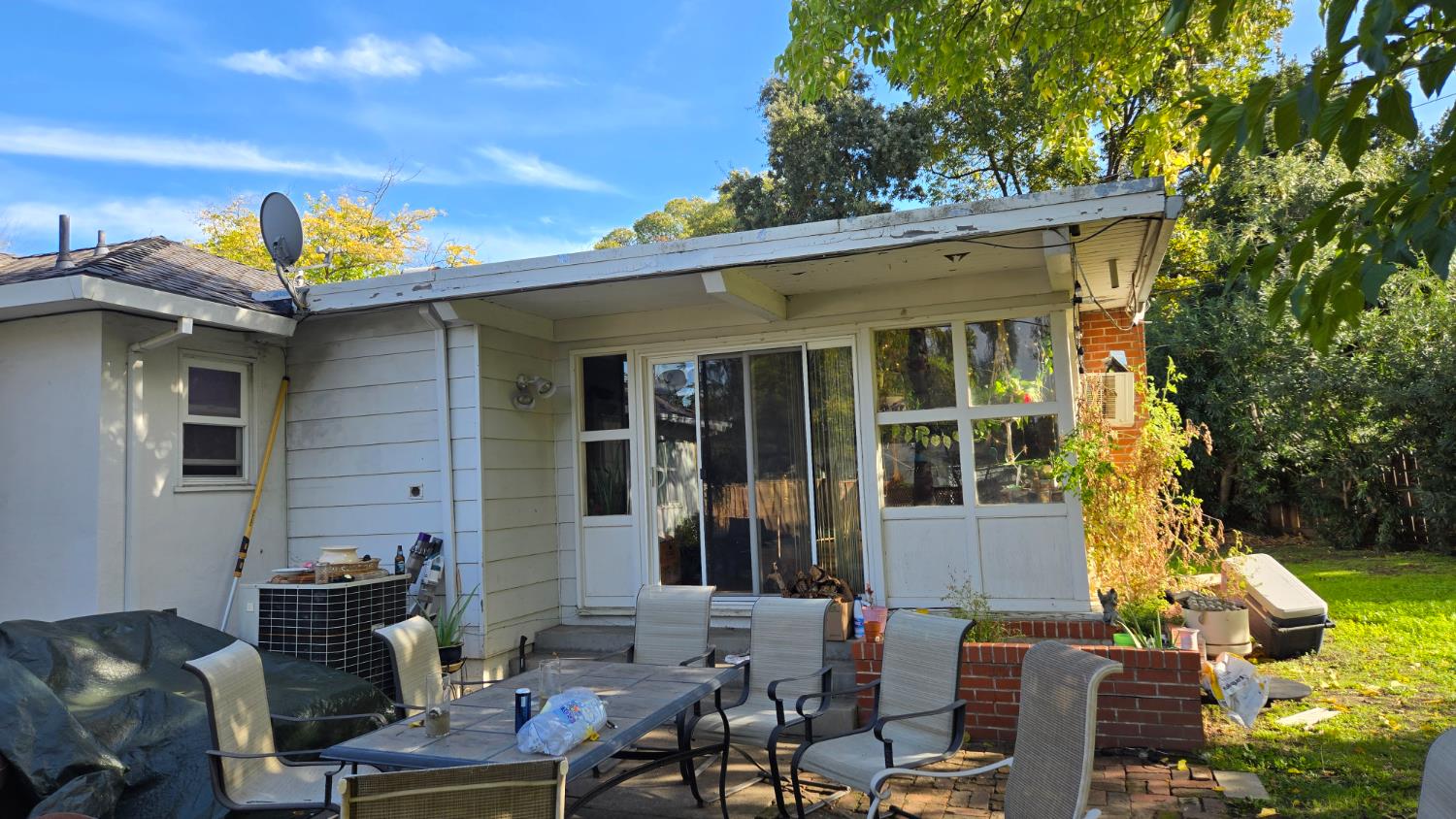 8043 Valencia Avenue Stockton, CA 95209 - Photo 14 of 15 a view of a patio with table and chairs and potted plants