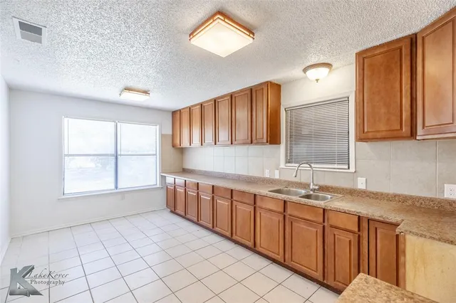 a view of a kitchen with a sink