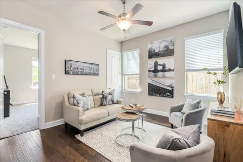 a living room with furniture and a large window
