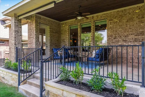 a view of a balcony with chairs