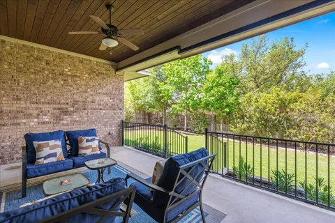 a roof deck with a table and chairs