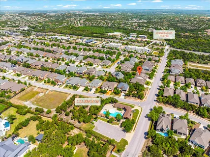 an aerial view of residential houses with outdoor space