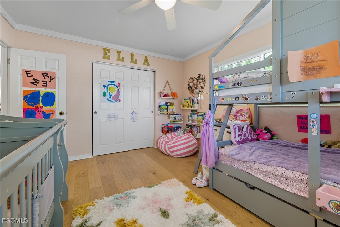 1420 Mandel Road Fort Myers, FL 33919 - Photo 13 of 41 a bedroom with bed and a chandelier