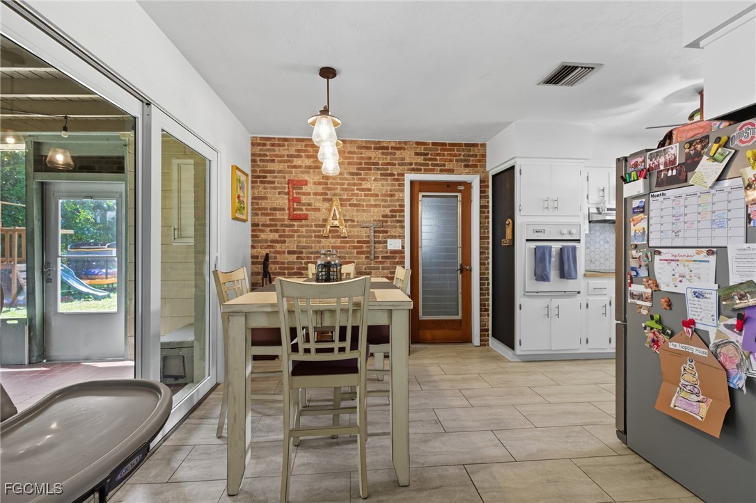 1420 Mandel Road Fort Myers, FL 33919 - Photo 15 of 41 a dining room with furniture and window