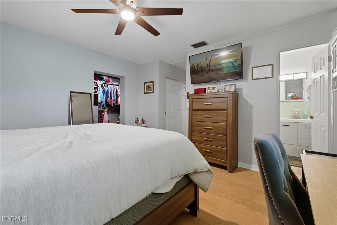 1420 Mandel Road Fort Myers, FL 33919 - Photo 23 of 41 a bedroom with a bed and a flat screen tv