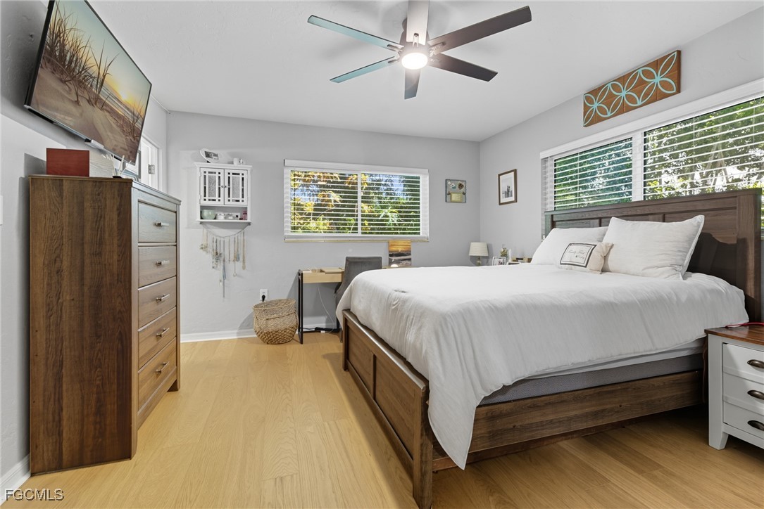 1420 Mandel Road Fort Myers, FL 33919 - Photo 24 of 41 a bedroom with a bed dresser and a window