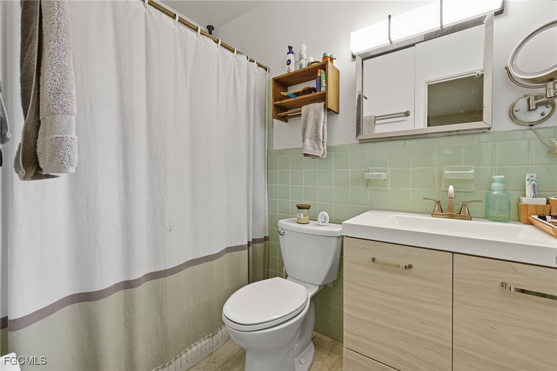 1420 Mandel Road Fort Myers, FL 33919 - Photo 25 of 41 a bathroom with a sink a toilet and shower