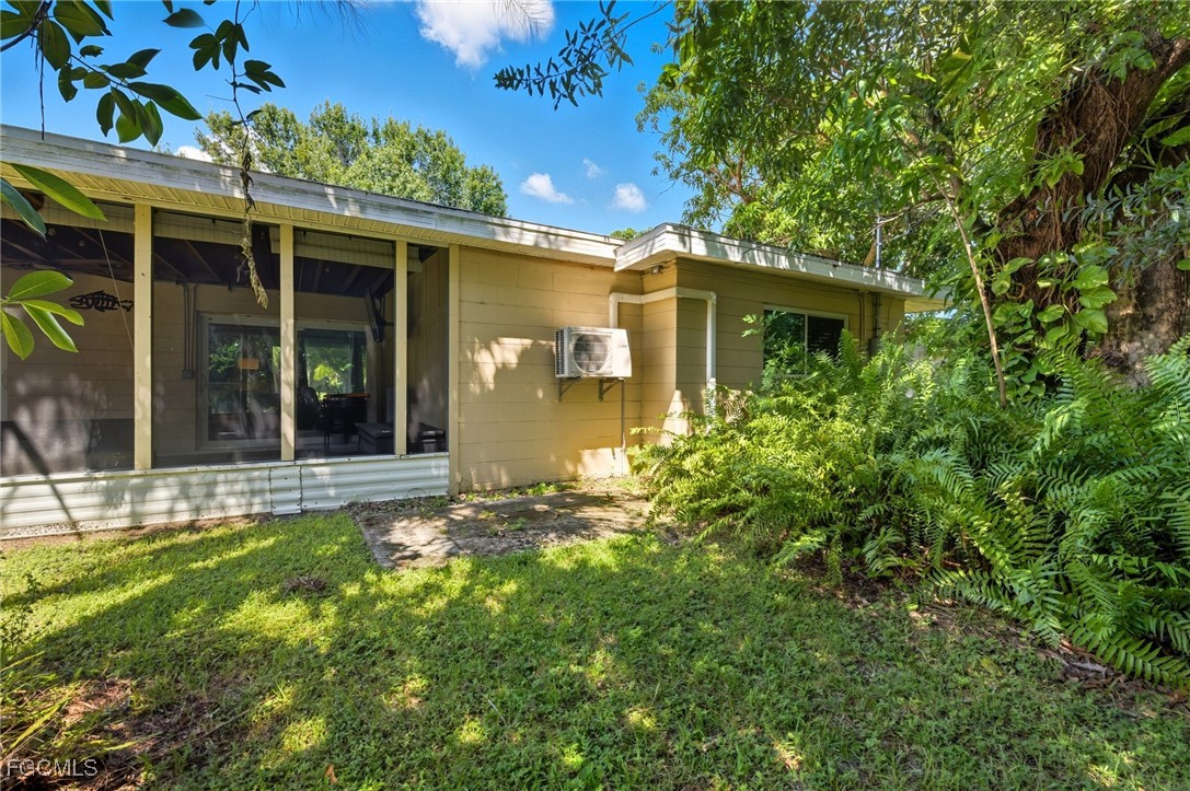 1420 Mandel Road Fort Myers, FL 33919 - Photo 34 of 41 front view of a house with a big yard