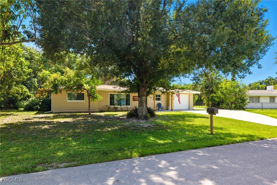 1420 Mandel Road Fort Myers, FL 33919 - Photo 38 of 41 a house with a tree in front of it