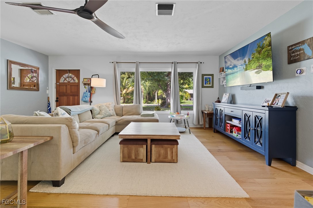1420 Mandel Road Fort Myers, FL 33919 - Photo 6 of 41 a living room with furniture and a flat screen tv