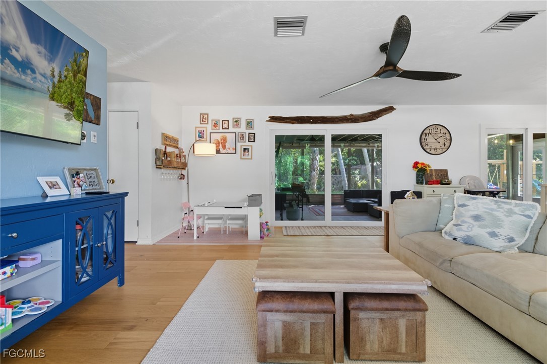 1420 Mandel Road Fort Myers, FL 33919 - Photo 9 of 41 a living room with furniture and wooden floor