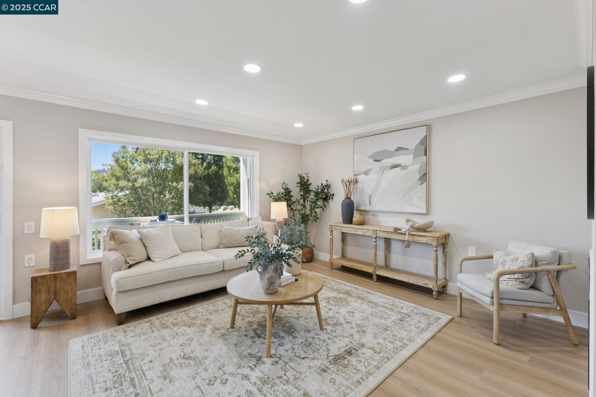 2101 Golden Rain Road, Unit 14 Walnut Creek, CA 94595 - Photo 17 of 52 a living room with furniture and a large window