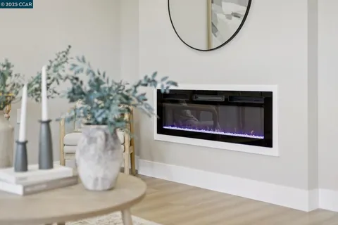 a white vase with flowers sitting on a table
